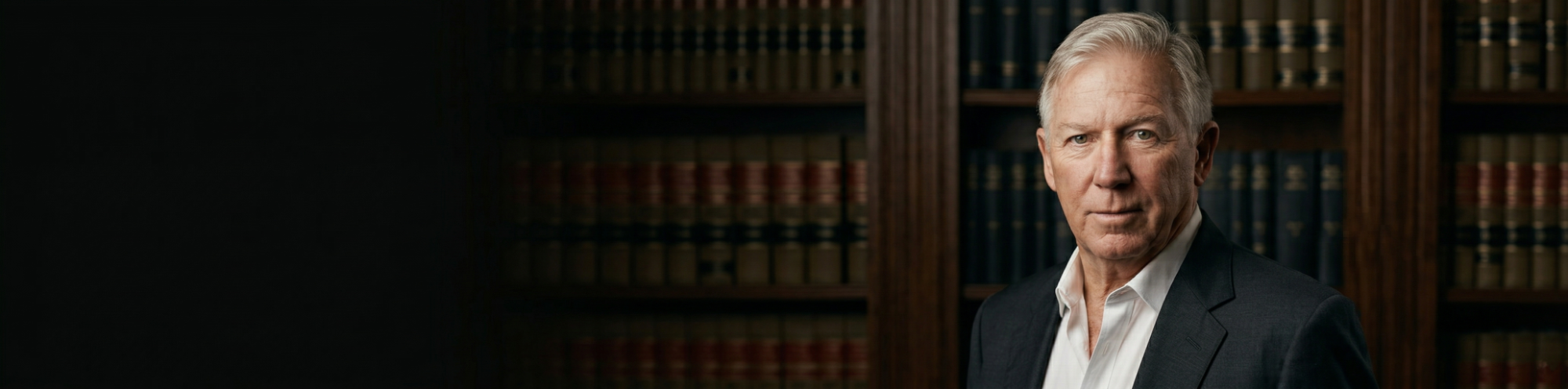 Terence Mix — trial attorney and author, photographed in a law library